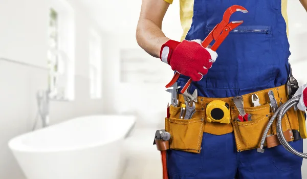 the torso of a plumbing technician showing a tool belt from Emergency Plumber San Marcos in San Marcos, TX - Commercial plumbing services
