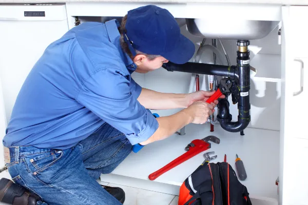 a male plumber fixing a toilet from Emergency Plumber San Marcos in San Marcos, TX a male plumber fixing a toilet from Emergency Plumber San Marcos in San Marcos, TX